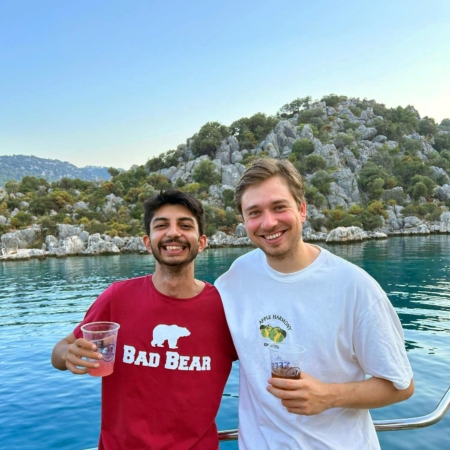 Young adults enjoying social moments and relaxing during the Fethiye to Olympos young adults gulet cruise in Turkey