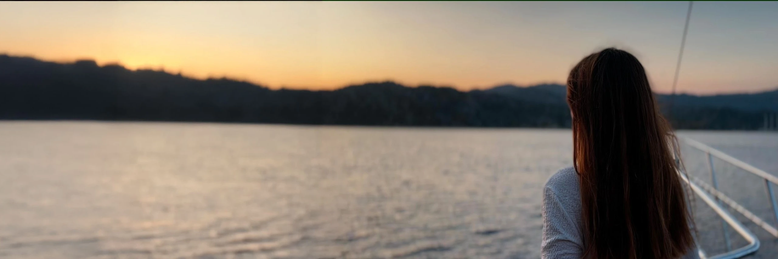 YourTourKey model sailing on a private Turkish gulet at sunset – Blue Cruise Turkey experience for friends and families.